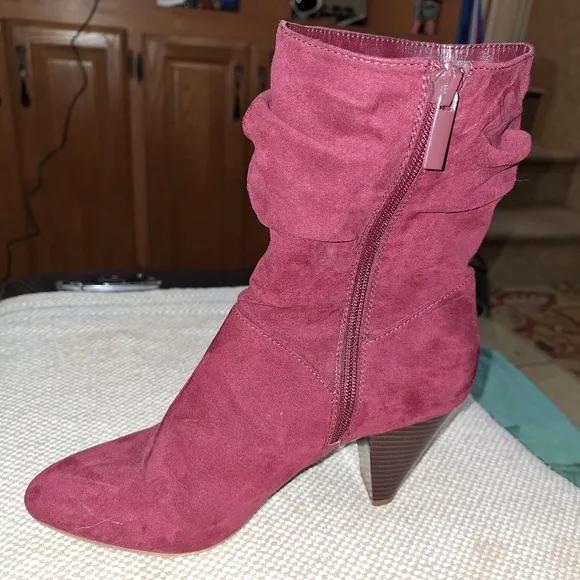 A pair of Kaari Blues Kensie burgundy booties in a ladies size 8.5.
