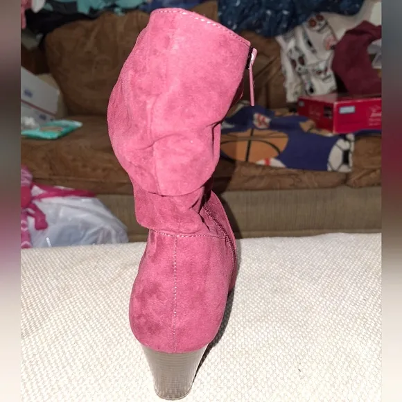 A pair of Kaari Blues Kensie burgundy booties in a ladies size 8.5.