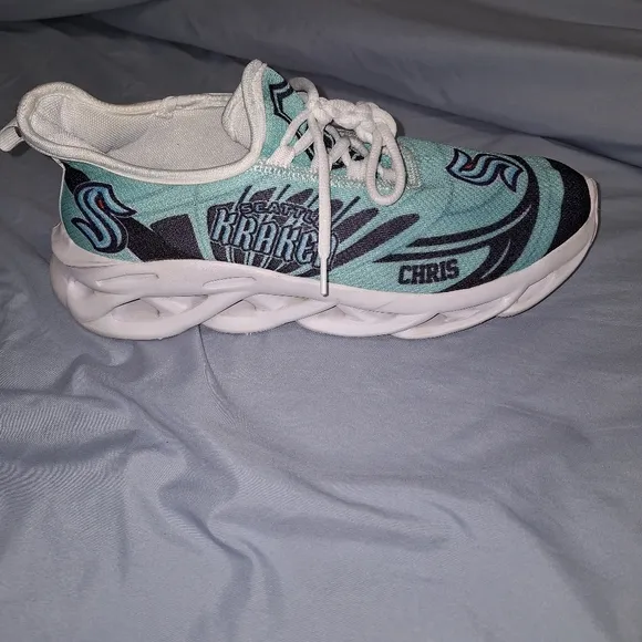 A pair of Seattle Kraken Chris athletic shoes in a EU 43 size 43, or US 9/9.5.