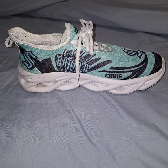 A pair of Seattle Kraken Chris athletic shoes in a EU 43 size 43, or US 9/9.5.