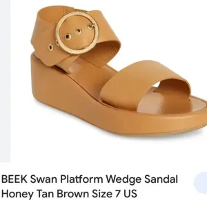 Beak swan platform sandals.