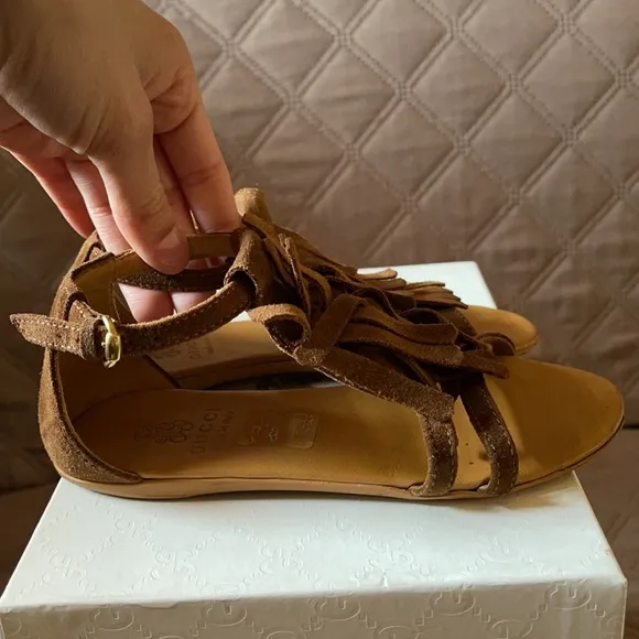 Brown Gucci sandals with fringe
