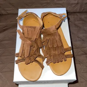 Brown Gucci sandals with fringe
