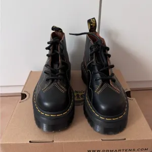 Dr. Martens Black and Yellow Platform Shoes