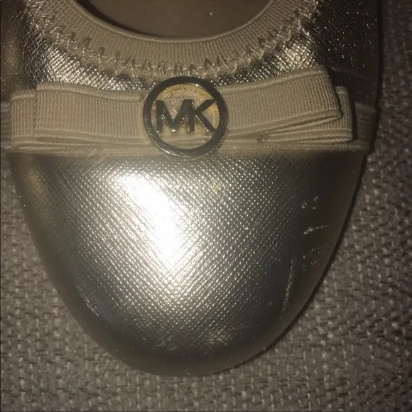 Michael Kors gold “Rover Lux” flats