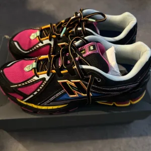 New Balance Pink and Black Athletic Shoes
