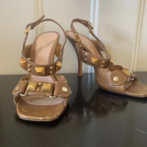 PRADA Bronze, vintage, heeled sandals with bronze &amp; silver stud details.  37.5
