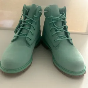 Timberland Ankle High Boots with lace up and tag. Size 4